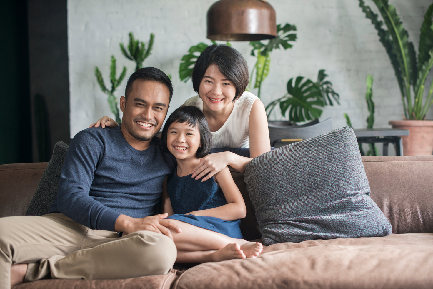 Young Asian family at home.